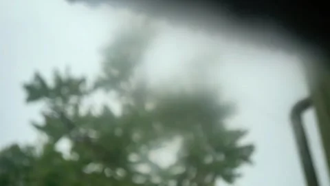 POV from the bedroom window while it's raining and storming outside Stock Footage 289695857