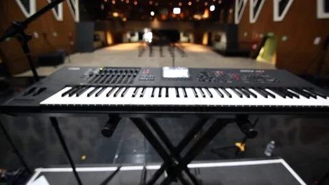 POV from behind microphone &amp; keyboard during sound check before a show Stock Footage 90637145