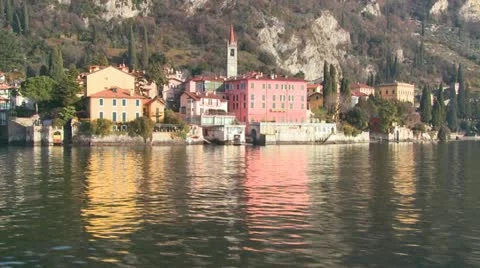 POV from a boat of the shores of Lake Como with the town of Varenna and the 스톡 동영상 11497853