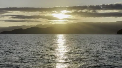 POV BOAT SIDE VIEW SUNSET SUN MOUNTAINS SEA COASTLINE BRAZIL UBATUBA Stock-Footage 239759787