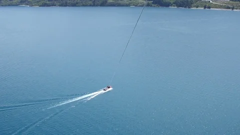 POV of Boat While Parasailing Stock Footage 77766092