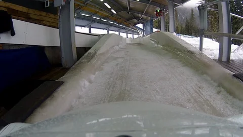 P.O.V of bobsled down track at 2010 Whistler Sliding Centre, B.C., Canada. Stock Footage 99248271