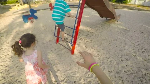 POV from a body mounted camera of children playing outdoors in a playground Video stock 77969367
