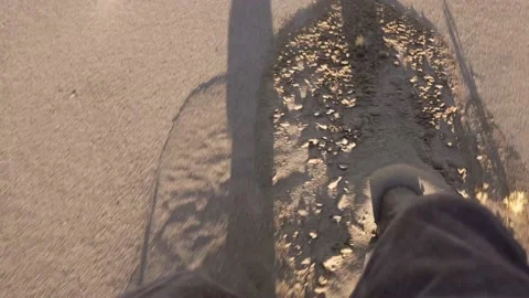 POV boots sliding through deep sand terrain Stock Footage 142980518