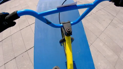 POV boy doing amazing stunts with bicycle Stock Footage 233662128