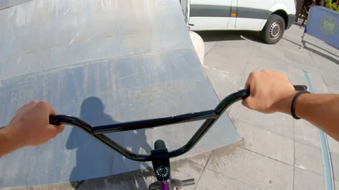 POV boy doing amazing stunts with bicycle Stockbeeldmateriaal 233663744