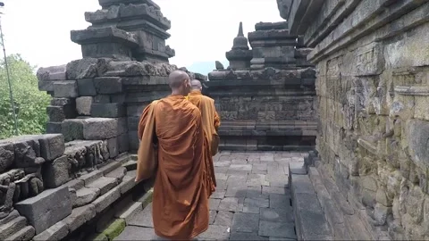 POV, Buddhist Monk walks on Temple Terrace, Borobudur, Java, Indonesia 스톡 동영상 244146341