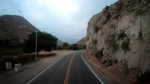 POV of a bus trip on the road while the rain wets the windshield and surrounded Stock Footage 164442482