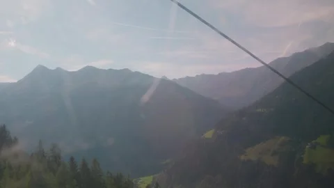 POV cable car ride descending into Stubai Valley, Austrian Alps Stock Footage 317217644