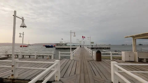 POV camera approaching to cafe on water, restaurant on pier, moving on bridge. Stock Footage 202601839