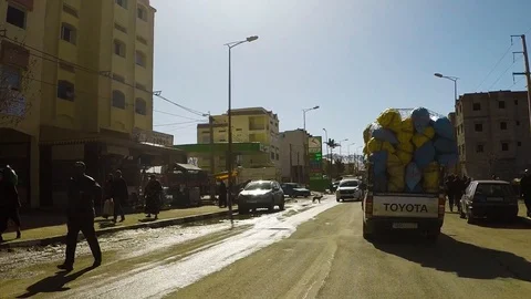 POV Camera car slow motion driving on road through small town 库存影片 127000691