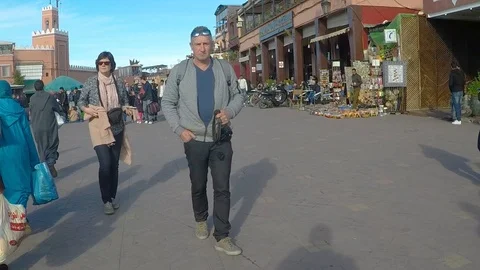 POV Camera human slow motion walk through market square 스톡 동영상 127000549