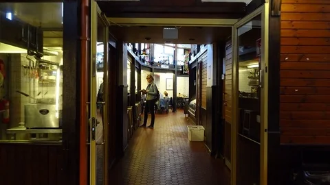 POV camera walk through old market aisle, go to cozy restaurant Stock Footage 70250664