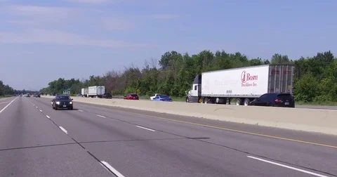 POV car and truck traffic driving on busy highway 401 in Ontario Canada Stock Footage