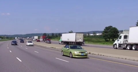 POV car and truck traffic driving on busy highway 401 in Ontario Canada Stock Footage