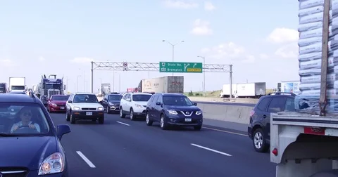 POV car and truck traffic driving on busy highway 401 in Ontario Canada Stock Footage