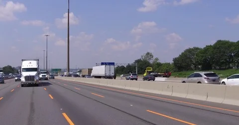POV car and truck traffic driving on busy highway 401 in Ontario Canada Stock Footage