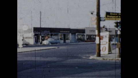 POV of Car at Crossroad and Shell Gas Station 1950s Vintage Film Nostalgic Movie Stock Footage 103202003