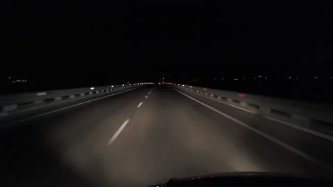 POV in the car, driving on a dark empty road, highway  in the middle of the n Stock Footage 208065474