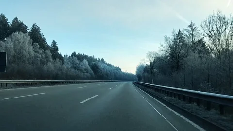 POV of car driving on empty highway in winter Stock Footage 118526670