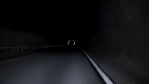 POV Car Driving Through Endless Tunnel Suspenseful Journey with Engine Sounds Stock Footage 287180925