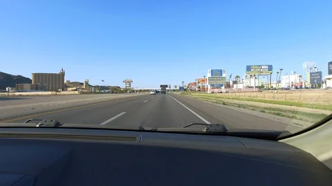 POV of car passenger passing through stateline between California and Nevada Stock Footage 89816874