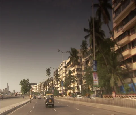 POV car ride down Marine Drive past hotels, residences and palm trees. Stock Footage 86741953