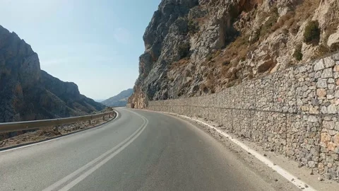 POV car riding through mountain national road in autumn. Auto driving at sunny Video stock 169908072