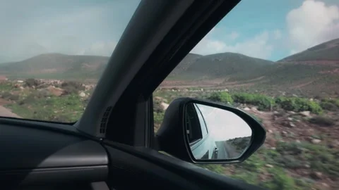 POV Car Side Mirror View Driving Scenic Road to Sidi Ifni Morocco Stock Footage 332772325
