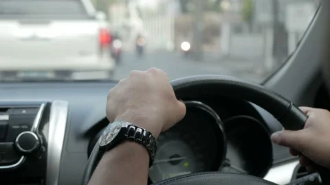 POV to the car steering wheel while driving on the road in soft focusing Stock Footage 167600625