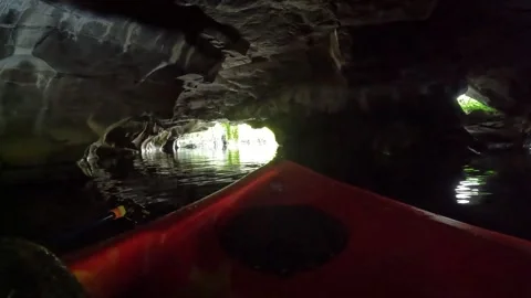 POV in a cave on a kayak Stock Footage 243593666