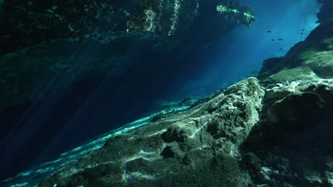 POV of Cavern Entrance With Rays Of Light breaking the Surface Stockbeeldmateriaal 272984841