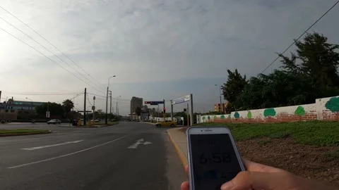 Pov checking your pace on the cell phone after running Stock Footage 149213924