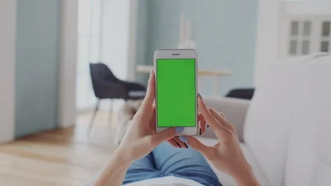 POV with Chromakey Tracking Screen or Green Screen Display. Young Woman Using Stock Footage 122415612