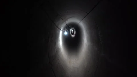POV Cinematic Tracking Shot Deep Inside Dark Underground Concrete Tunnel Vídeos de archivo 334941144