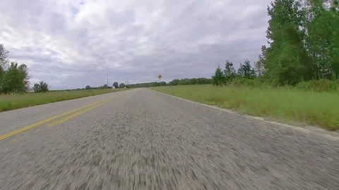 POV close to the ground view of driving on an old rock paved road Stock Footage 142112576