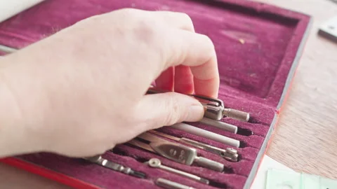 POV Close-Up Hand Picks Metal Tool, Precision Choice in Technical Work Stock Footage 333496355