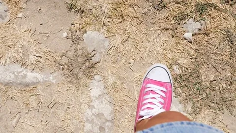 POV - Close up on young man Feet Walking In the nature Stock Footage