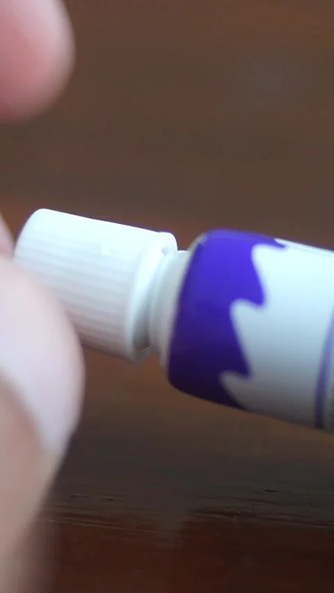Pov, Closeup Of Hand Opens An Acrylic Paint Tube - Vertical Footage Stock Footage 340852210