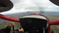 POV of co-pilot of training plane flying over village, dangerous sport, extreme HD Footage