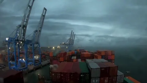 POV Container Ship Docking at Industrial Harbor in Rain 4K Stock Footage 331765094