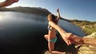 Pov Couple Holding Hands Jumping Into Lake Stock Footage