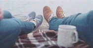 Pov: Couple Relaxing On The Beach. Woman Taking A Cup With Drink Slow Motion 4K Stock Footage