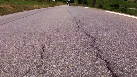 POV CYCLISTS RACING DOWN ROAD 02 Stock Footage 141050940