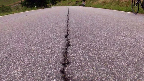 POV CYCLISTS RACING DOWN ROAD 01 Stock Footage 141052365