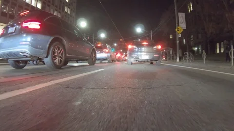 POV dark low angle drive at night on city of Toronto streets Stock Footage 99394252