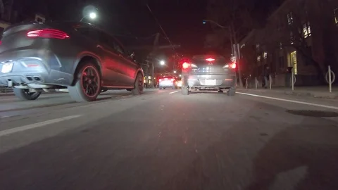 POV dark low angle drive at night on city of Toronto streets Stock Footage 99394541