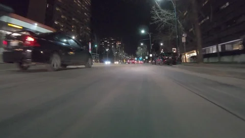 POV dark low angle drive at night on city of Toronto streets Stock Footage 99396959