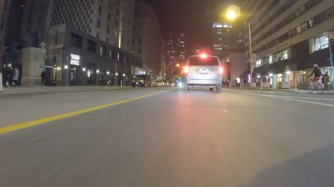POV dark low angle drive at night on city of Toronto streets Stock Footage 99397342