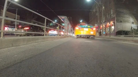 POV dark low angle drive at night on city of Toronto streets Stock Footage 99398482